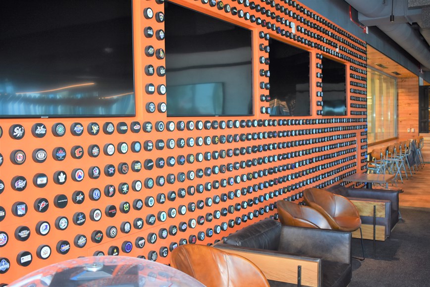 Find your favorite team on the Wall of Pucks!