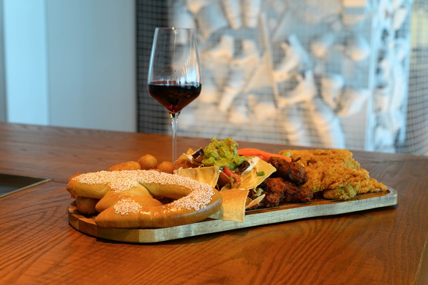 Power Play Platter - House Nachos, Ducks Buttered Pretzel, Chicken Wings, Mini Corn Dogs, and Chicken Tenders Served with a Selection of Dipping Sauces: Honey Mustard, Ranch, Beer Cheese Sauce, Tangy BBQ